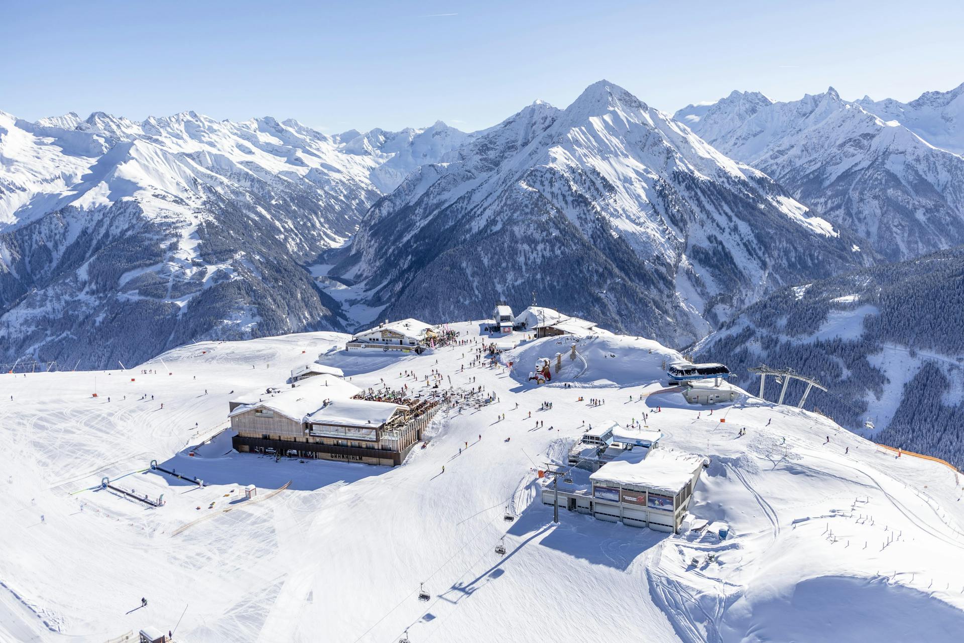 Skiers enjoying snowy slopes of Austrian ski resort Tux
